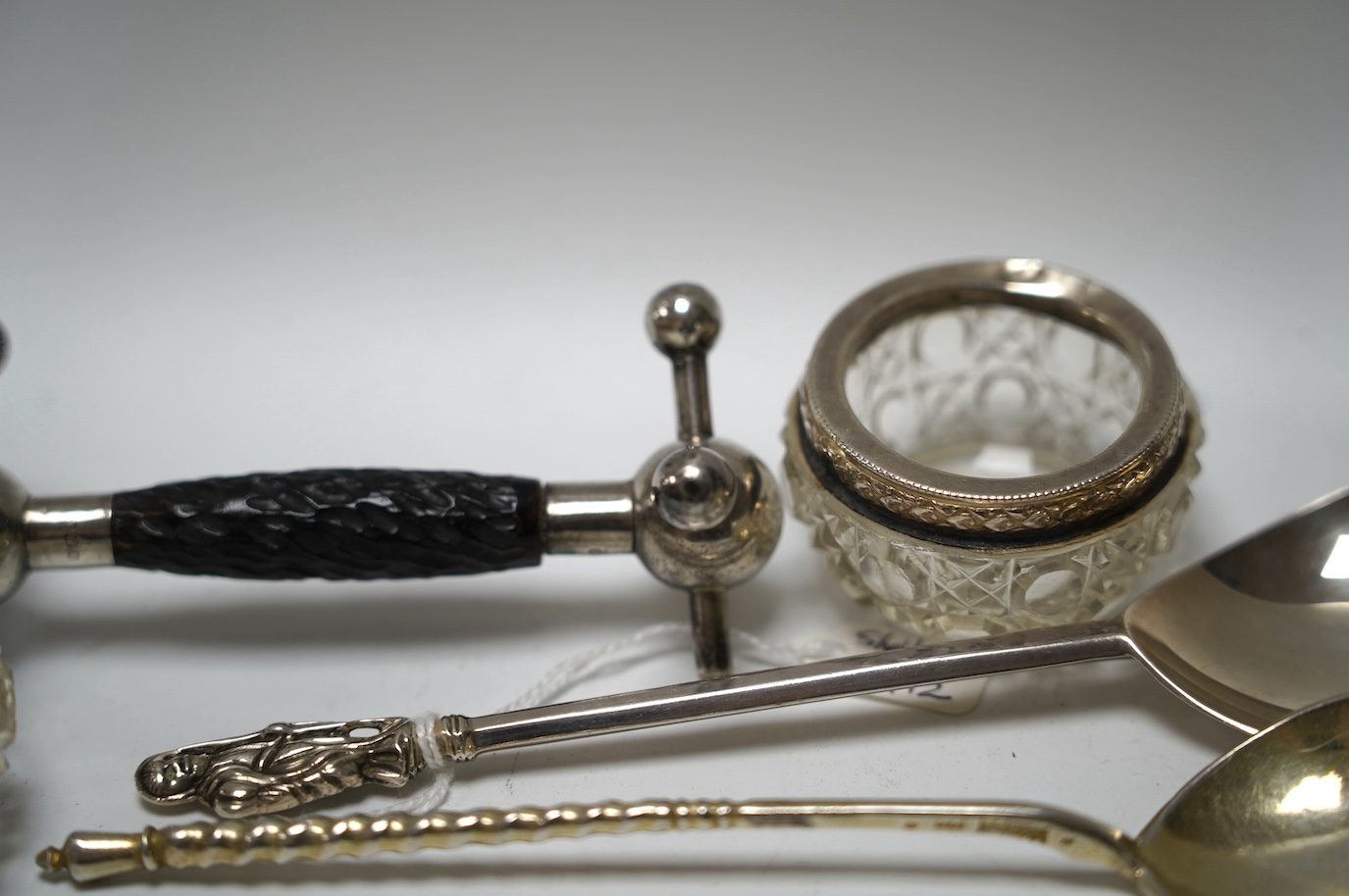 A late 19th century Russian engraved 84 zolotnik spoon, dated 1890, 16.8cm, a George V silver apostle spoon, together with three other items including silver mounted glass salts. Condition - poor to fair to good